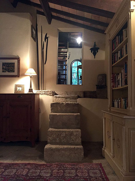 A set of uneven steps leads to the tower, where the bedrooms and bathroom are found